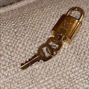 Louis Vuitton brass lock & key set